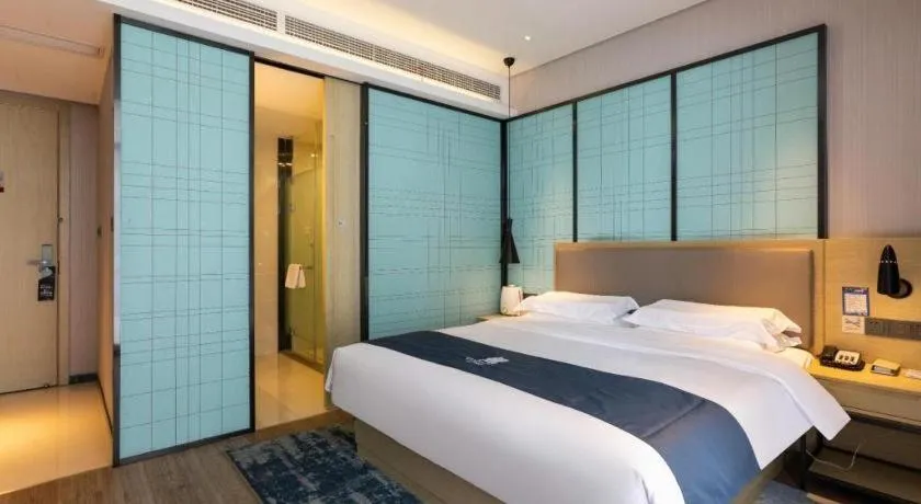 Bed in Echarm Hotel Nanjing Jiangning Tianyin Avenue Metro Station