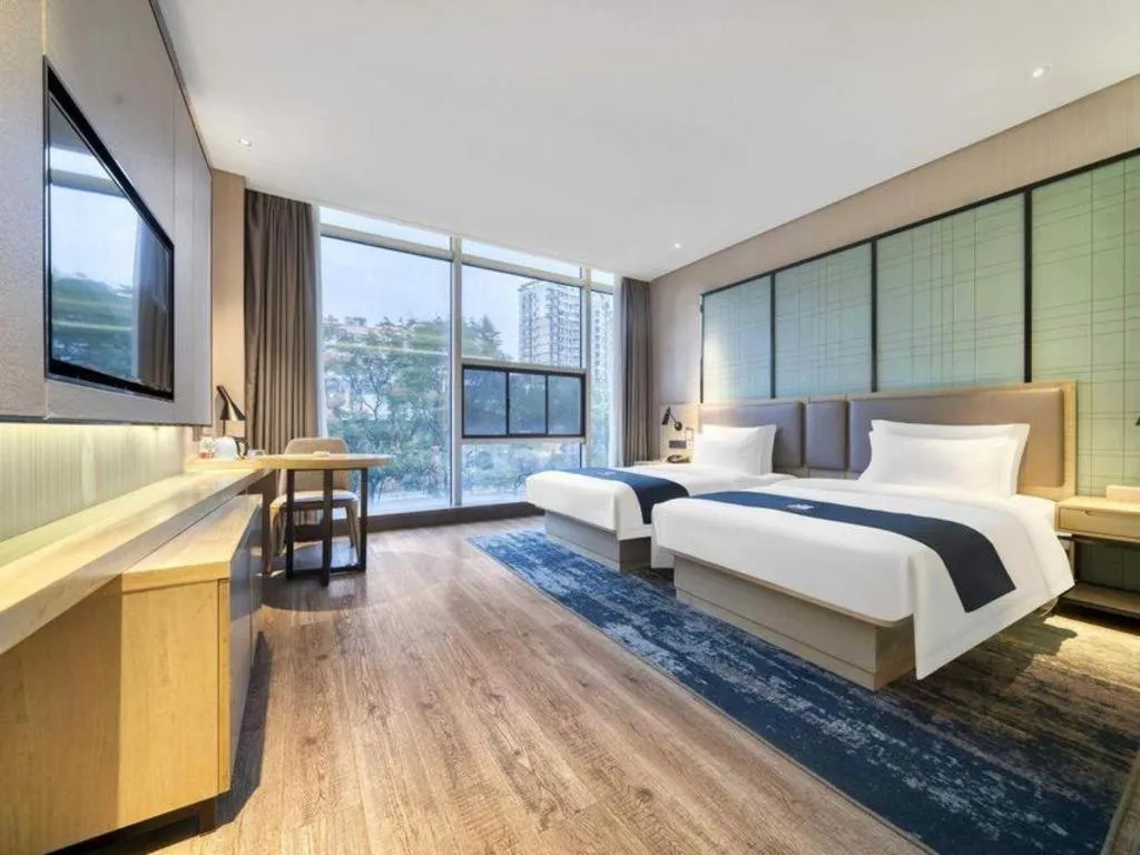 Bed in Echarm Hotel Nanjing Jiangning Tianyin Avenue Metro Station