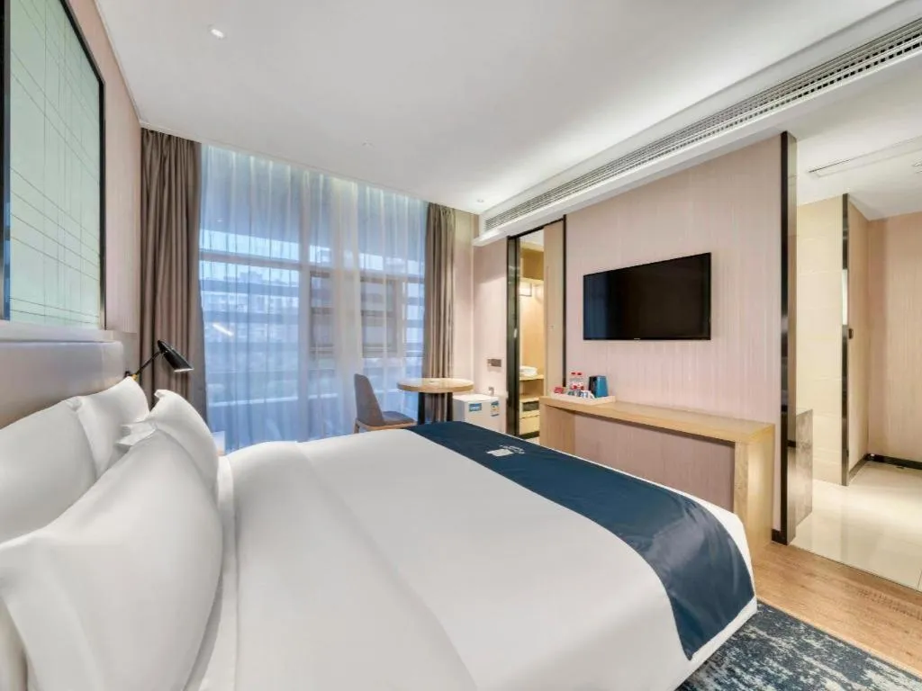 Bed in Echarm Hotel Nanjing Jiangning Tianyin Avenue Metro Station