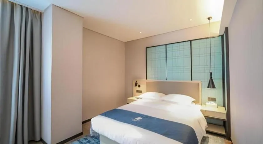 Bed in Echarm Hotel Nanjing Jiangning Tianyin Avenue Metro Station