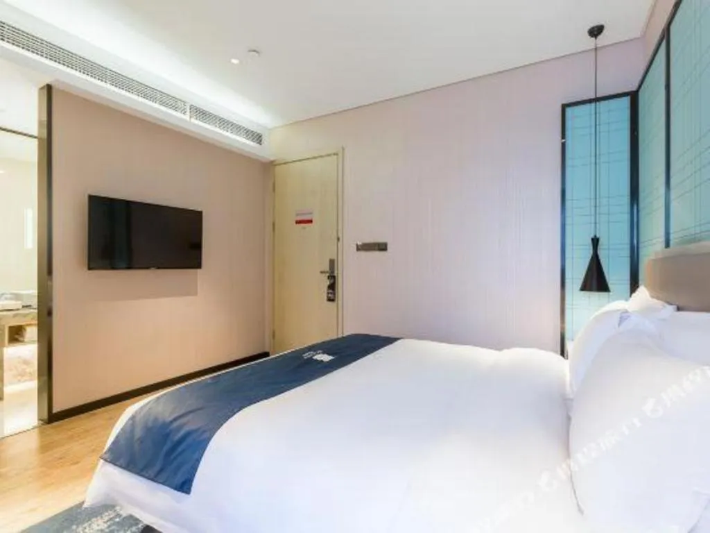 Bed in Echarm Hotel Nanjing Jiangning Tianyin Avenue Metro Station