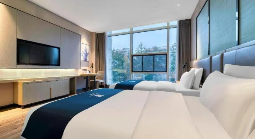 Bed in Echarm Hotel Nanjing Jiangning Tianyin Avenue Metro Station