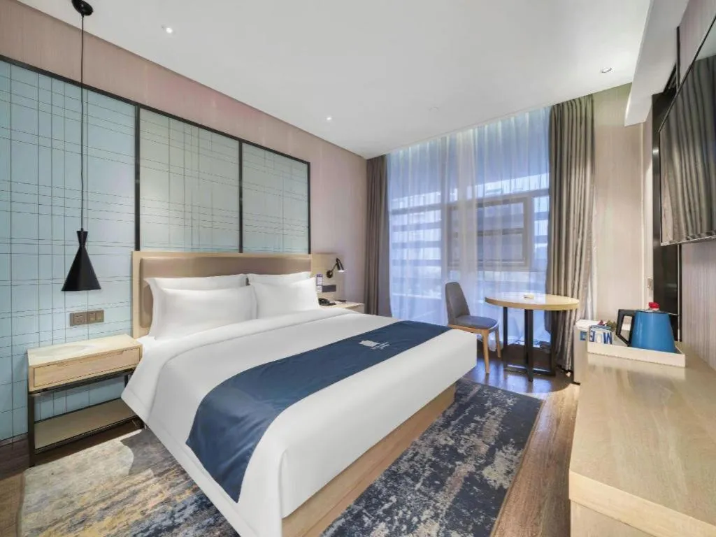 Bed in Echarm Hotel Nanjing Jiangning Tianyin Avenue Metro Station