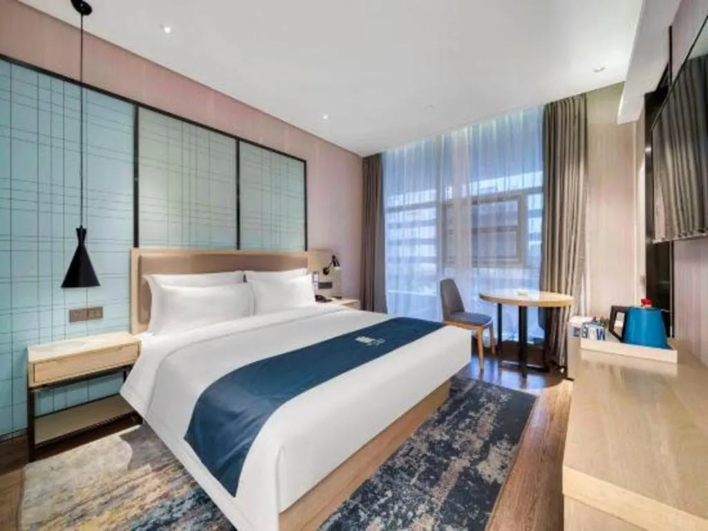 Bed in Echarm Hotel Nanjing Jiangning Tianyin Avenue Metro Station