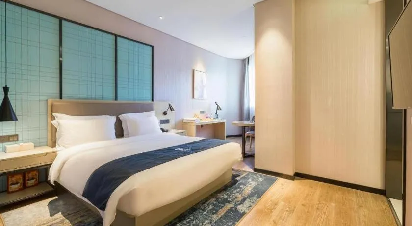 Bed in Echarm Hotel Nanjing Jiangning Tianyin Avenue Metro Station