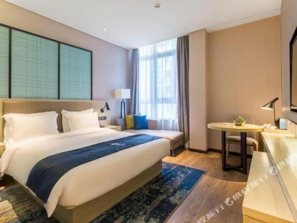 Bed in Echarm Hotel Nanjing Jiangning Tianyin Avenue Metro Station