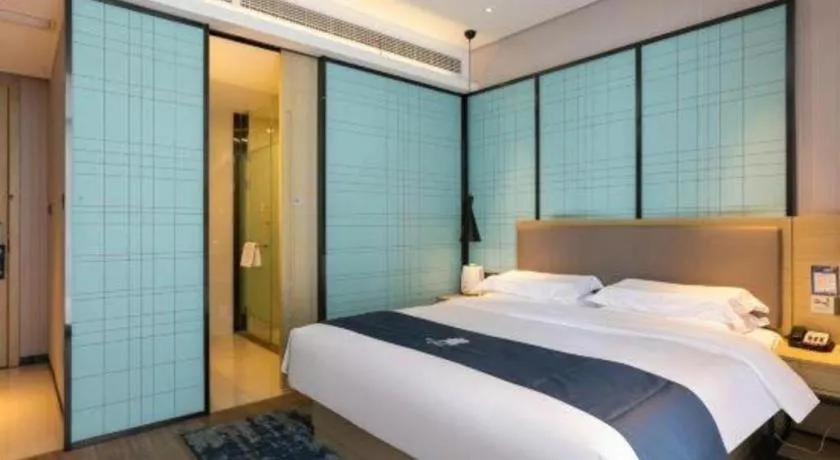 Bed in Echarm Hotel Nanjing Jiangning Tianyin Avenue Metro Station