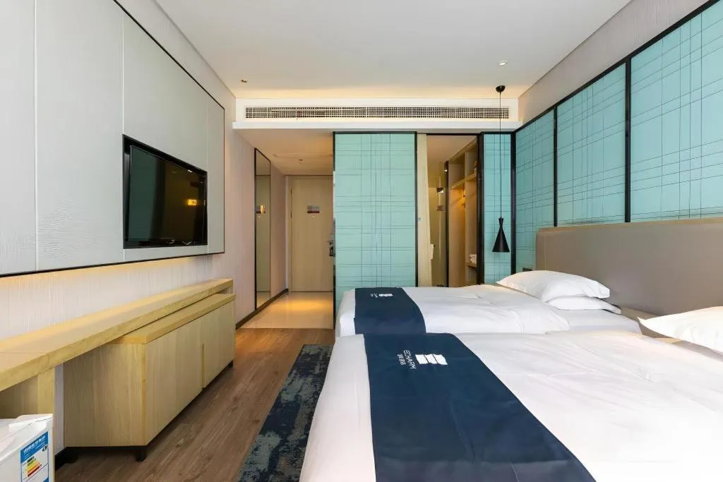 Bed in Echarm Hotel Nanjing Jiangning Tianyin Avenue Metro Station
