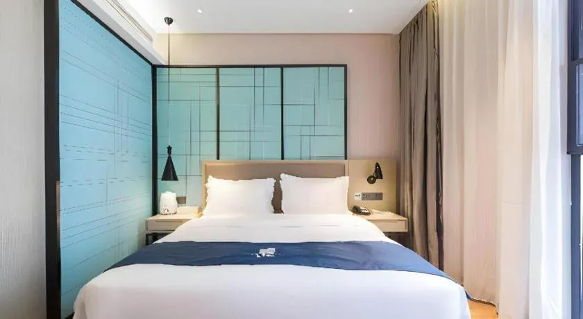 Bed in Echarm Hotel Nanjing Jiangning Tianyin Avenue Metro Station