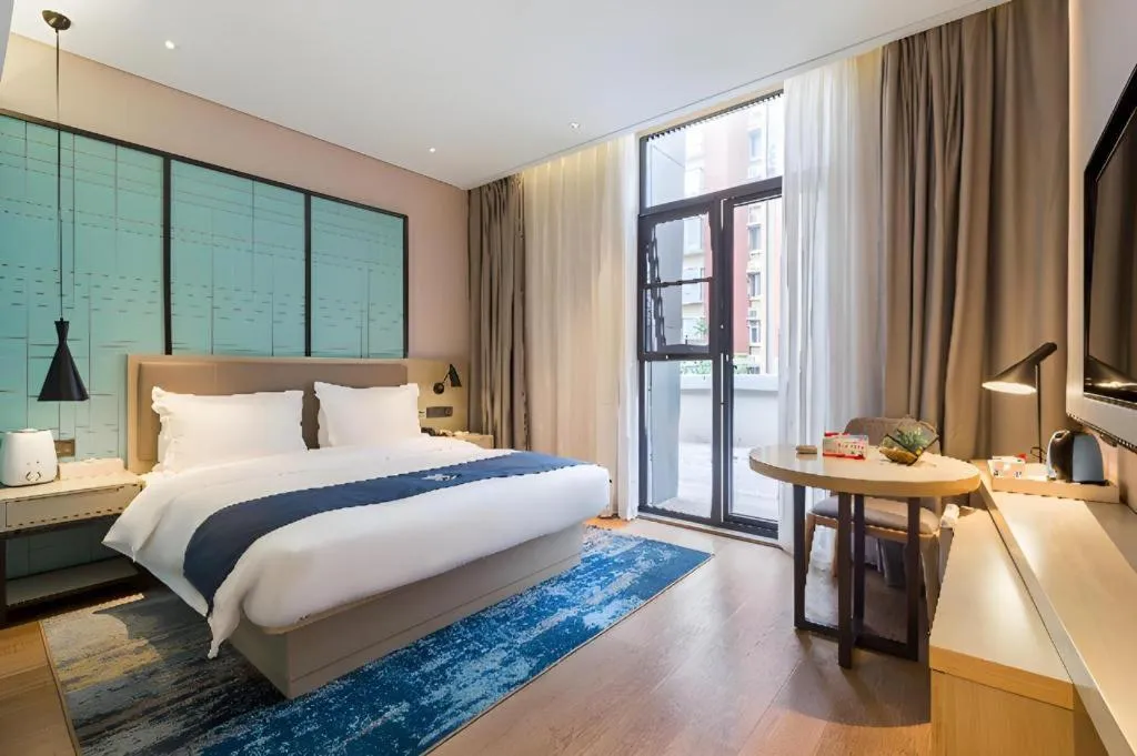 Bed in Echarm Hotel Nanjing Jiangning Tianyin Avenue Metro Station