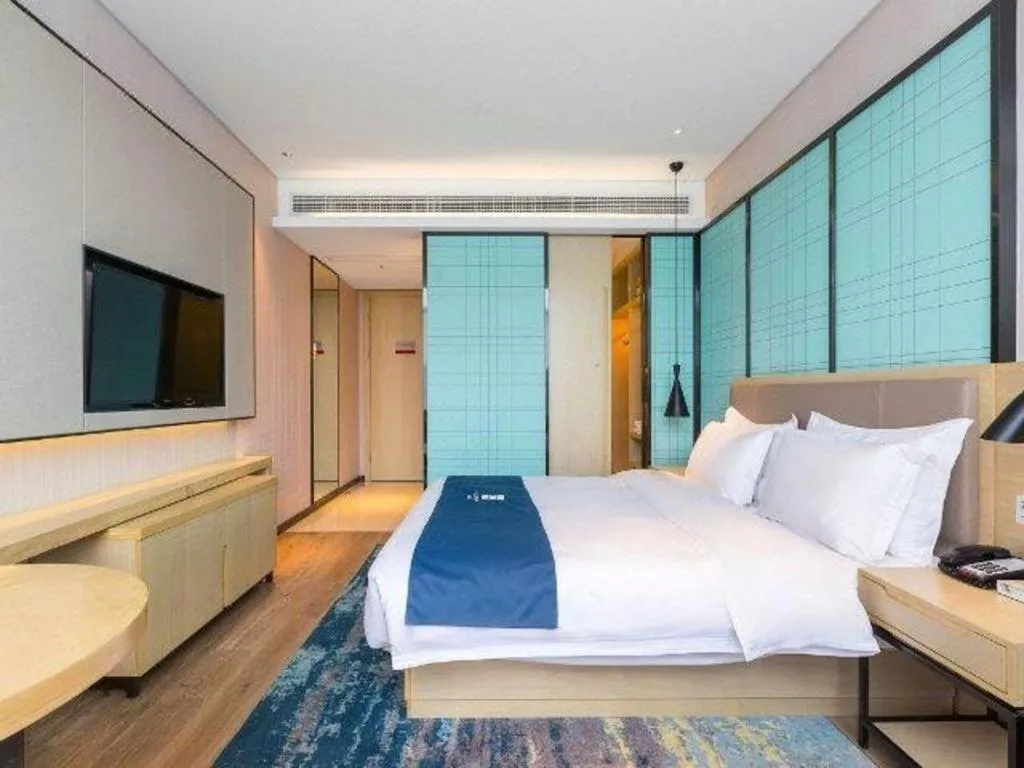 Bed in Echarm Hotel Nanjing Jiangning Tianyin Avenue Metro Station