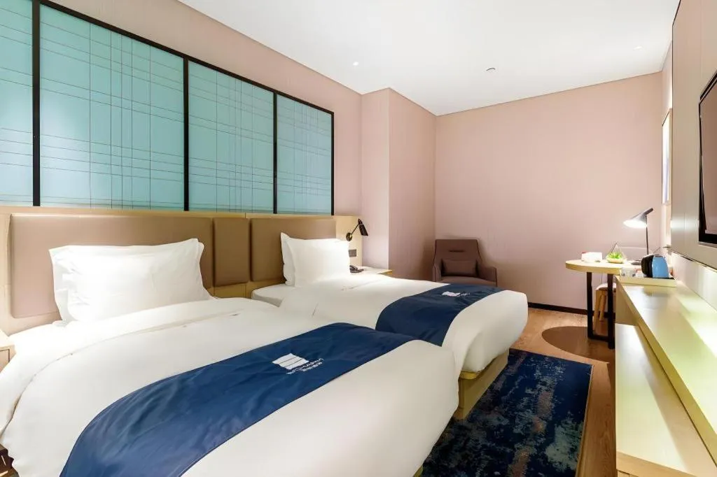 Bed in Echarm Hotel Nanjing Jiangning Tianyin Avenue Metro Station