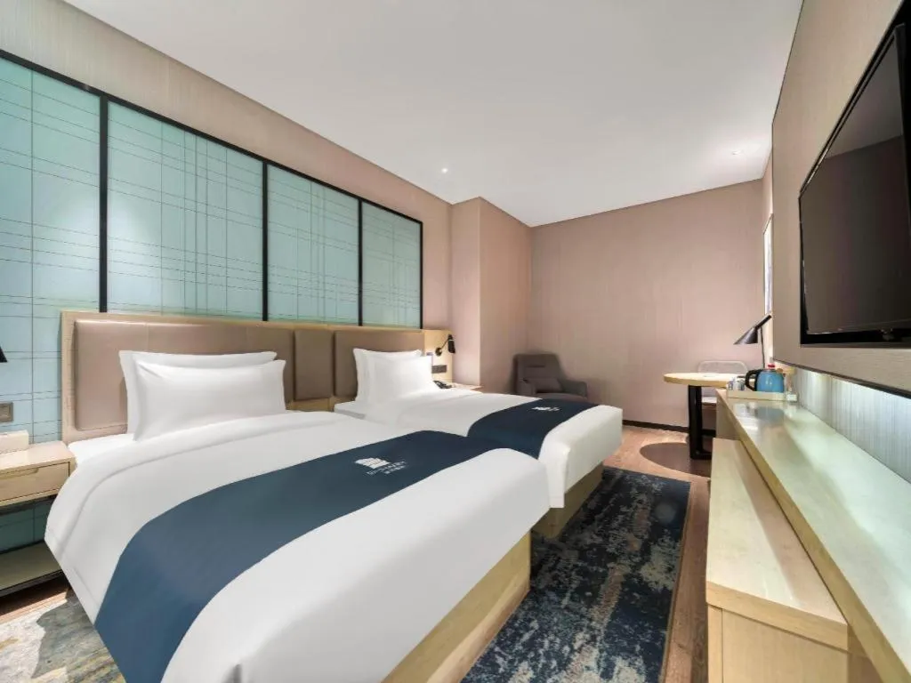 Bed in Echarm Hotel Nanjing Jiangning Tianyin Avenue Metro Station