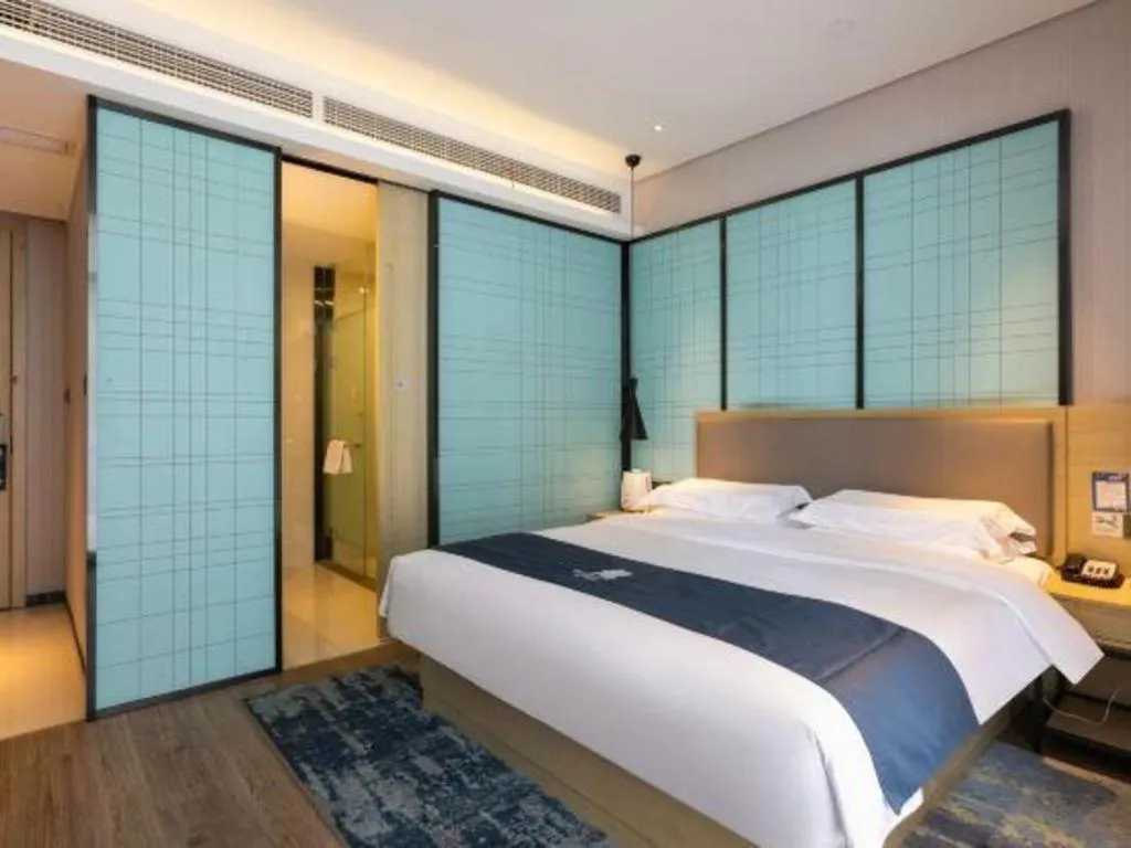 Bed in Echarm Hotel Nanjing Jiangning Tianyin Avenue Metro Station
