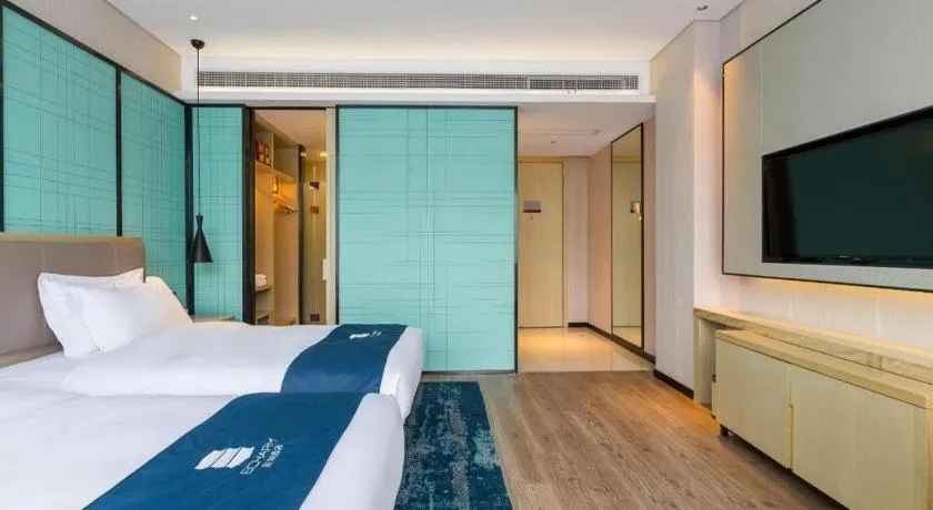 Bed in Echarm Hotel Nanjing Jiangning Tianyin Avenue Metro Station