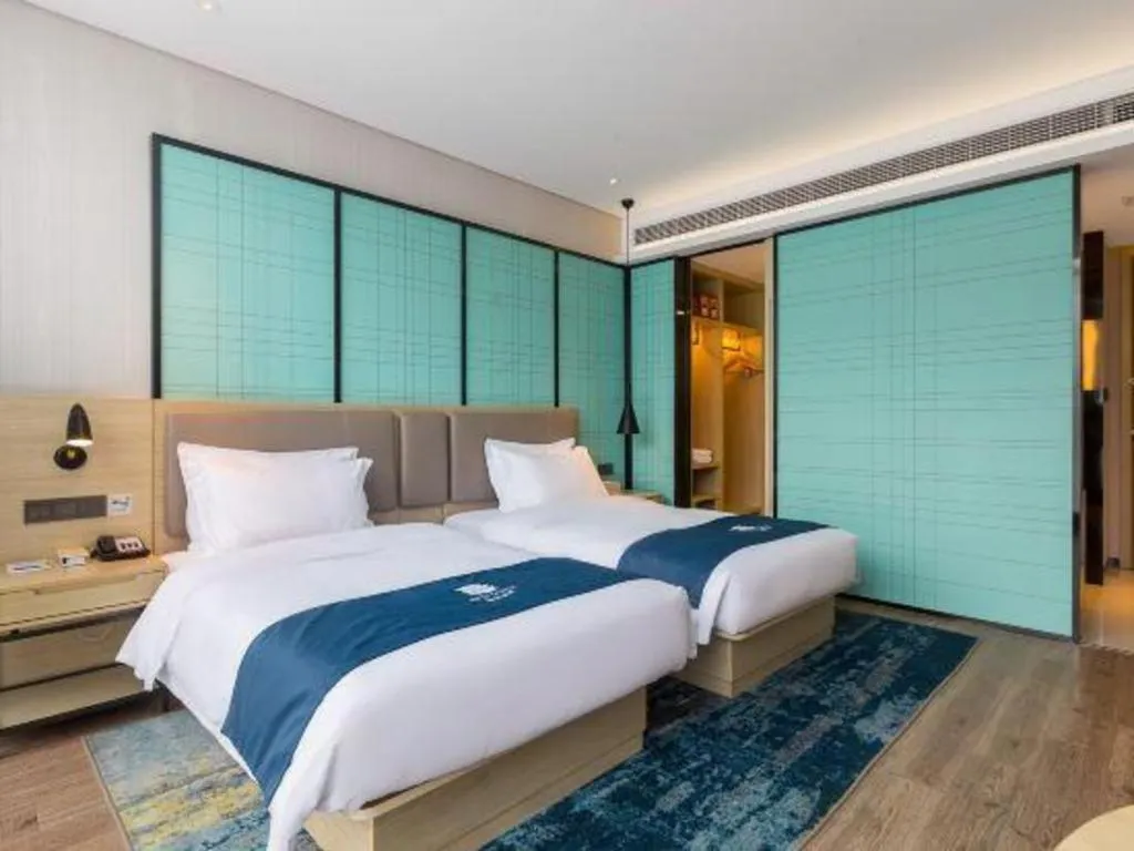 Bed in Echarm Hotel Nanjing Jiangning Tianyin Avenue Metro Station