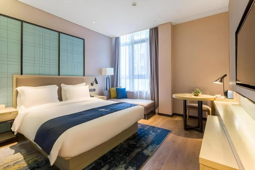 Bed in Echarm Hotel Nanjing Jiangning Tianyin Avenue Metro Station