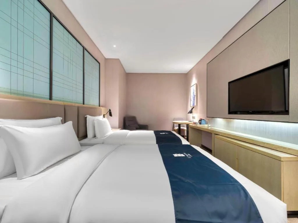 Bed in Echarm Hotel Nanjing Jiangning Tianyin Avenue Metro Station