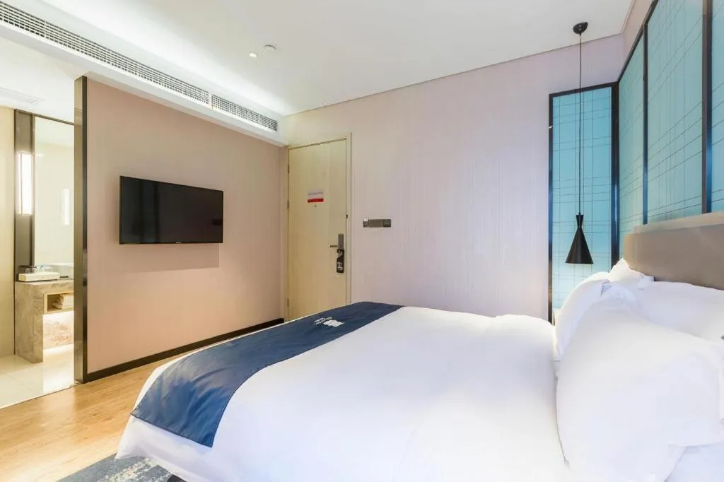 Bed in Echarm Hotel Nanjing Jiangning Tianyin Avenue Metro Station