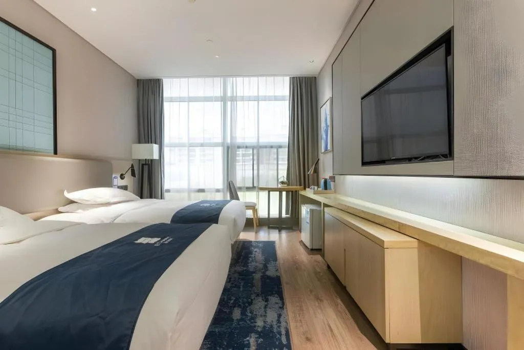 Bed in Echarm Hotel Nanjing Jiangning Tianyin Avenue Metro Station