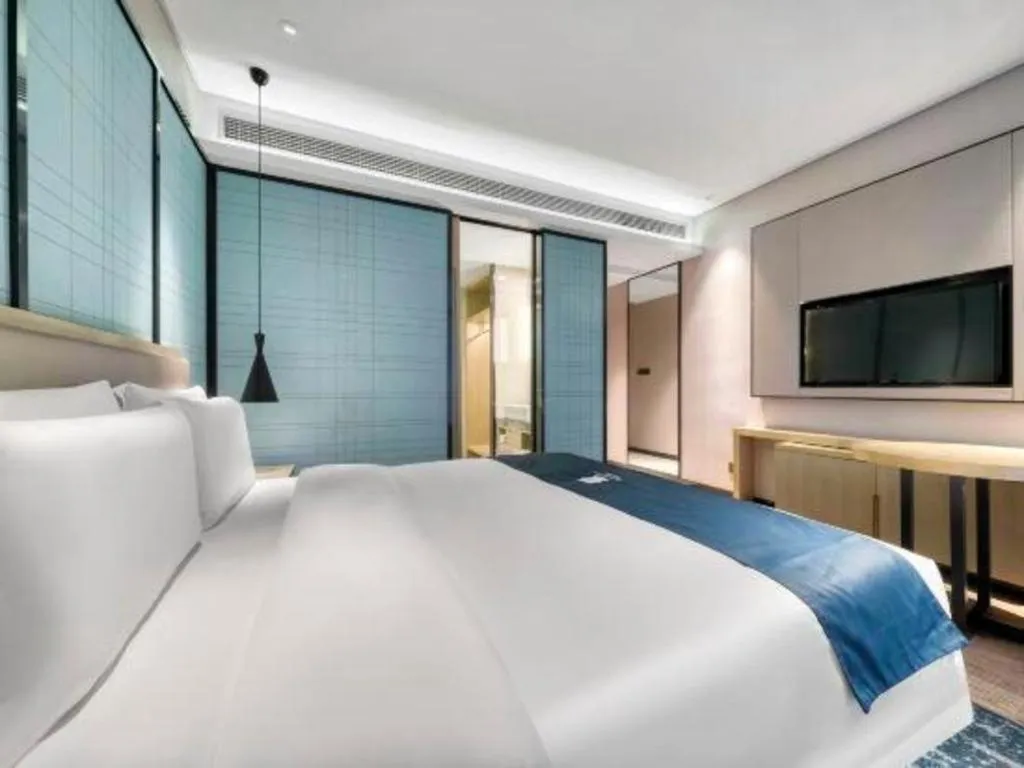 Bed in Echarm Hotel Nanjing Jiangning Tianyin Avenue Metro Station