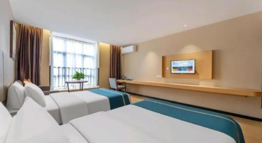 Bed in JTOUR Inn Maoming Gaozhou Guabangling Park