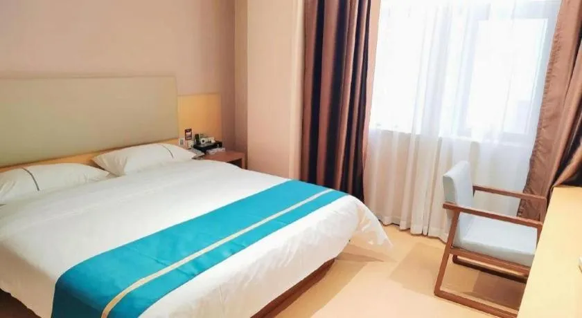 Bed in JTOUR Inn Maoming Gaozhou Guabangling Park