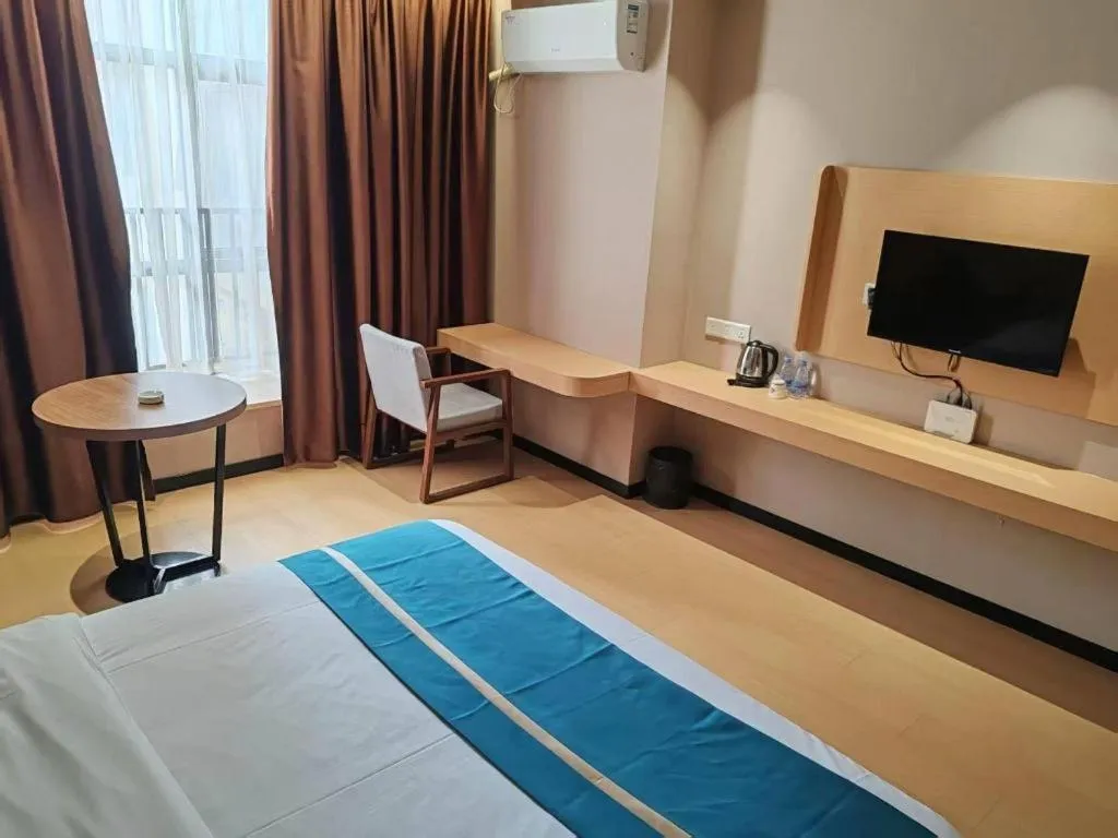 Bed in JTOUR Inn Maoming Gaozhou Guabangling Park