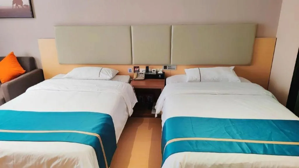 Bed in JTOUR Inn Maoming Gaozhou Guabangling Park