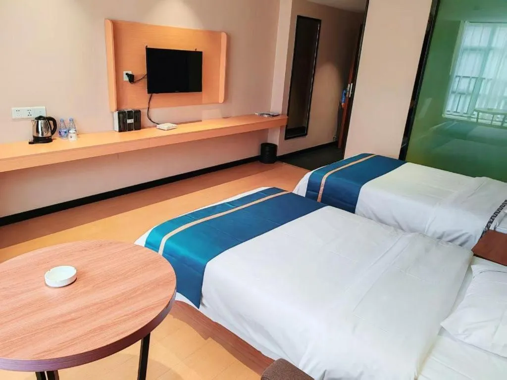 Bed in JTOUR Inn Maoming Gaozhou Guabangling Park