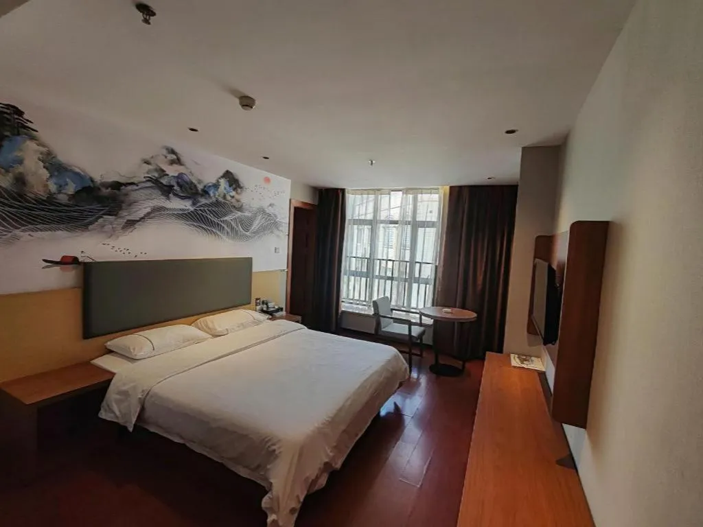 Bed in JTOUR Inn Maoming Gaozhou Guabangling Park