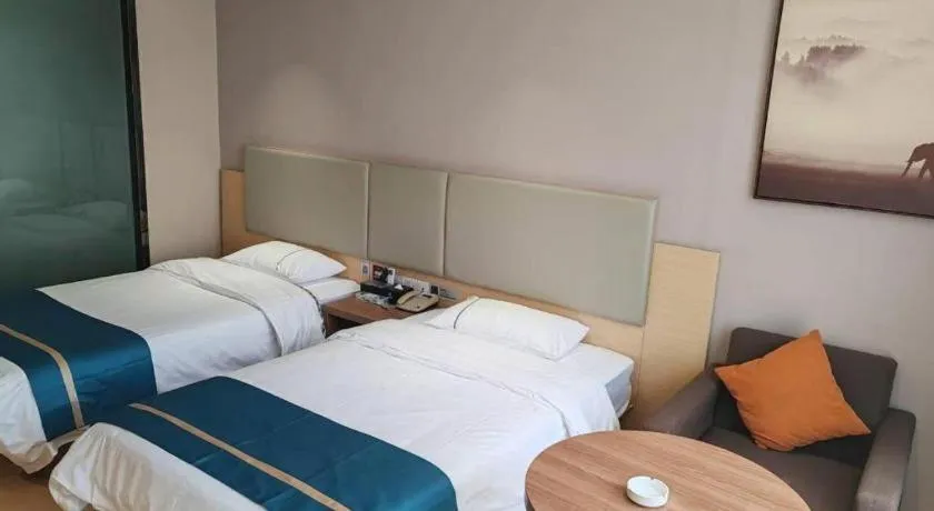 Bed in JTOUR Inn Maoming Gaozhou Guabangling Park