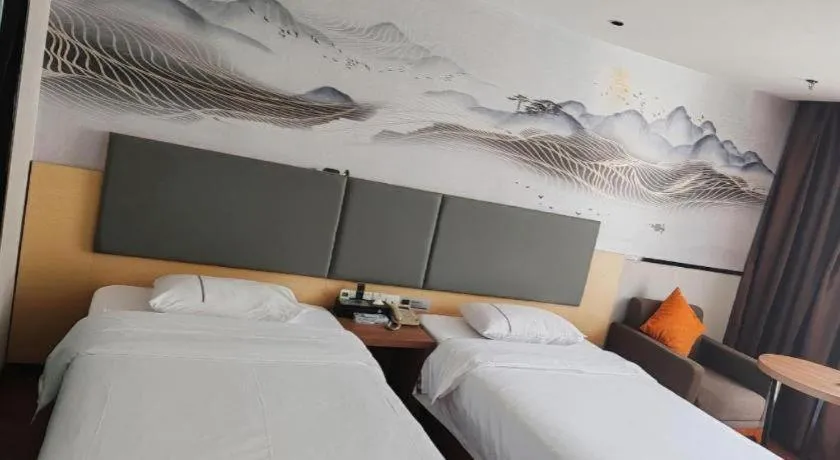 Bed in JTOUR Inn Maoming Gaozhou Guabangling Park