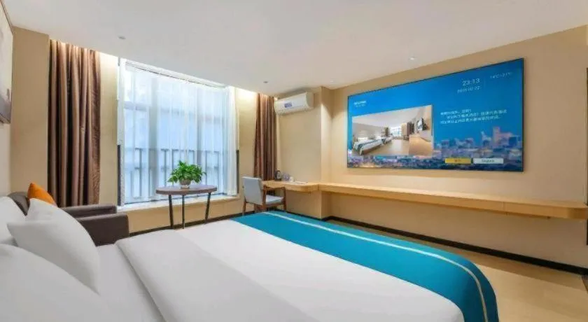 Bed in JTOUR Inn Maoming Gaozhou Guabangling Park