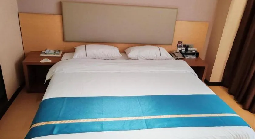 Bed in JTOUR Inn Maoming Gaozhou Guabangling Park