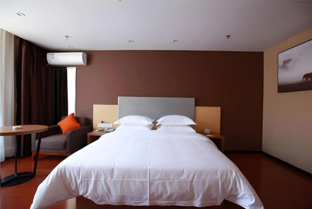 Bed in JTOUR Inn Maoming Gaozhou Guabangling Park