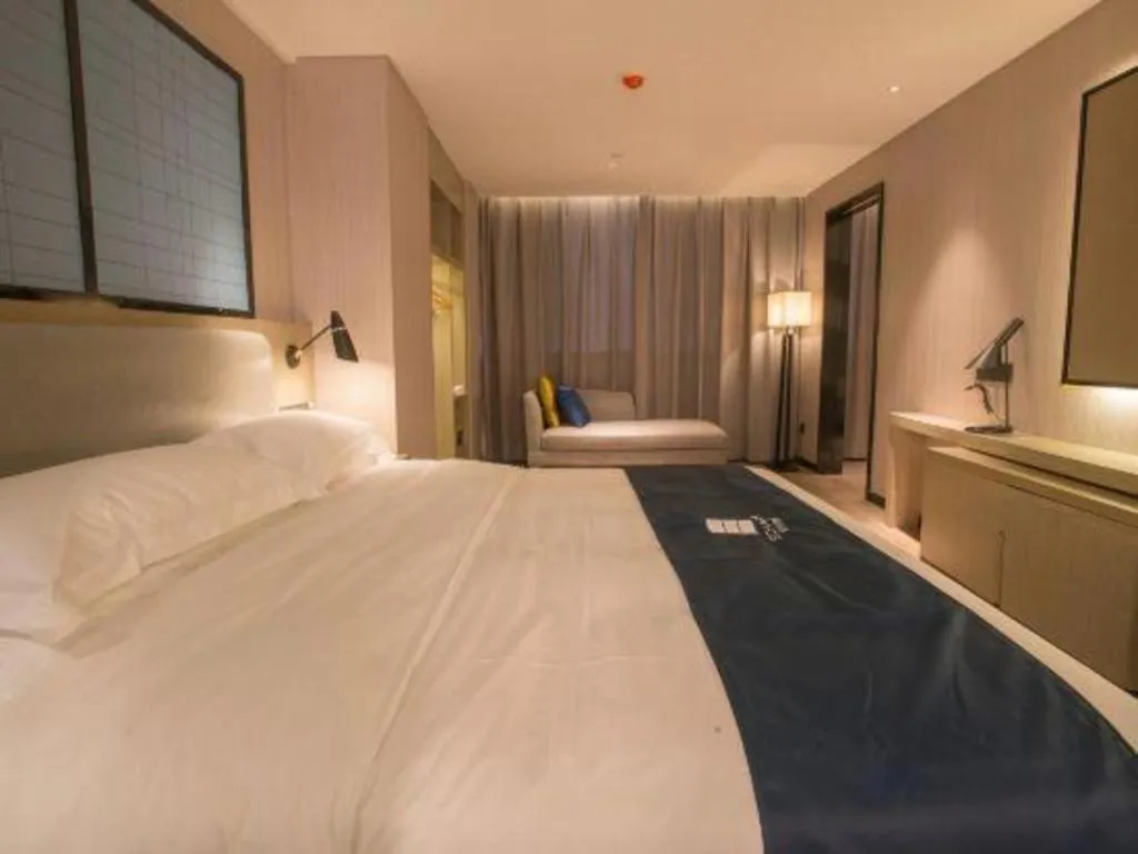 Bed in Echarm Hotel Wuhan Vanke Future Center Wulidun Metro Station