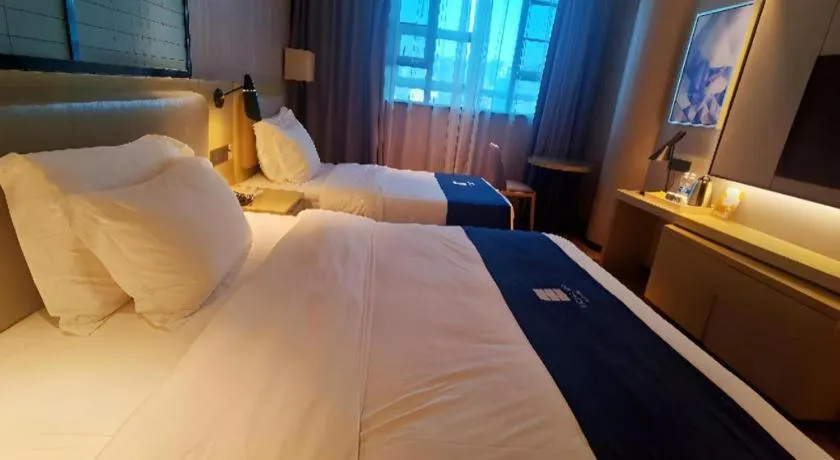 Bed in Echarm Hotel Wuhan Vanke Future Center Wulidun Metro Station