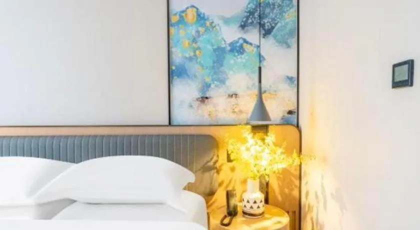 Bed in Echarm Hotel Wuhan Vanke Future Center Wulidun Metro Station