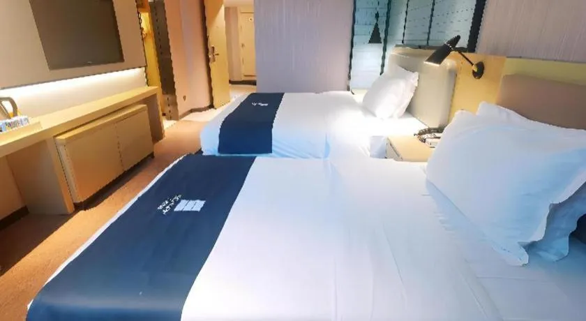 Bed in Echarm Hotel Wuhan Vanke Future Center Wulidun Metro Station