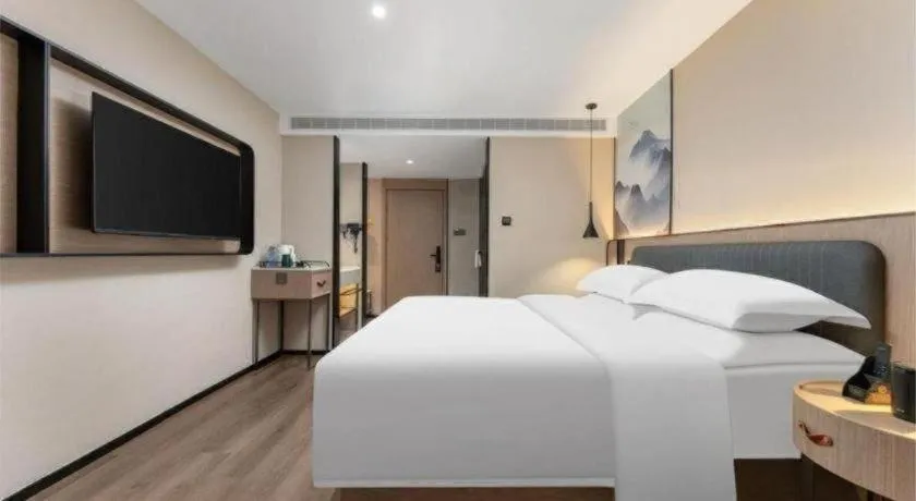 Bed in Echarm Hotel Wuhan Vanke Future Center Wulidun Metro Station