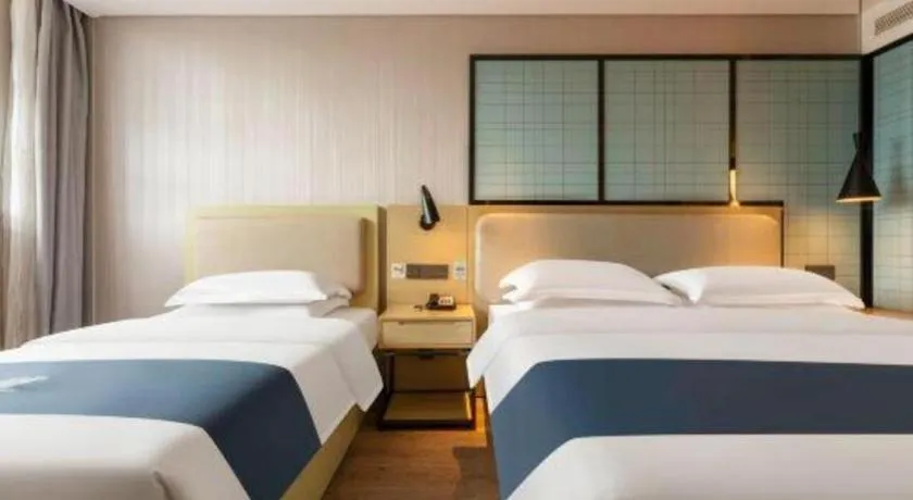 Bed in Echarm Hotel Wuhan Vanke Future Center Wulidun Metro Station