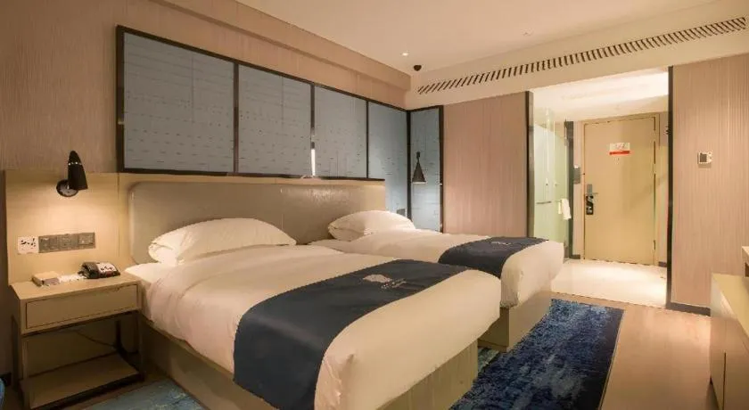 Bed in Echarm Hotel Wuhan Vanke Future Center Wulidun Metro Station