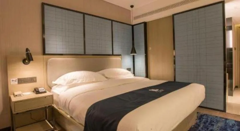 Bed in Echarm Hotel Wuhan Vanke Future Center Wulidun Metro Station