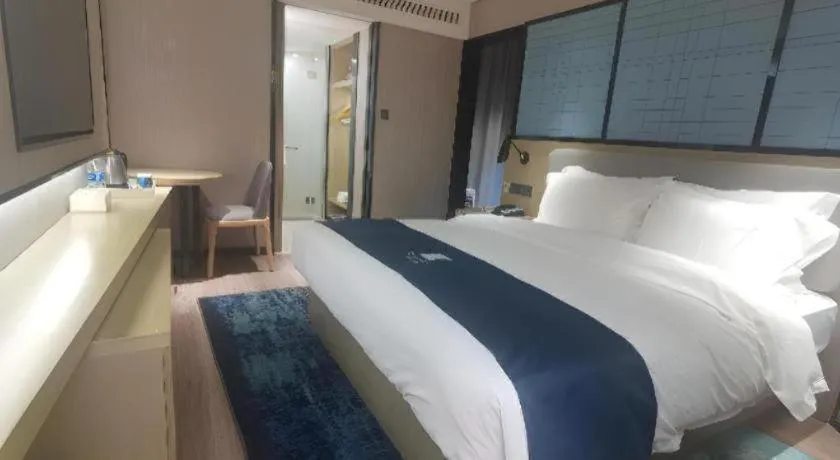 Bed in Echarm Hotel Wuhan Vanke Future Center Wulidun Metro Station