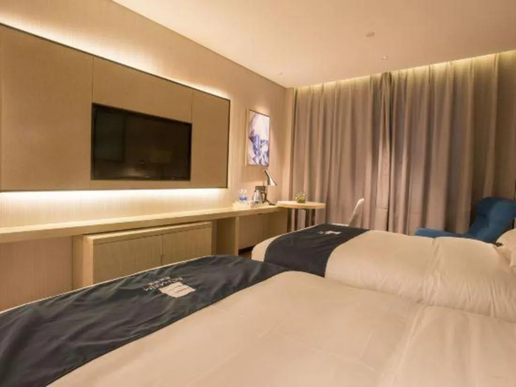 Bed in Echarm Hotel Wuhan Vanke Future Center Wulidun Metro Station