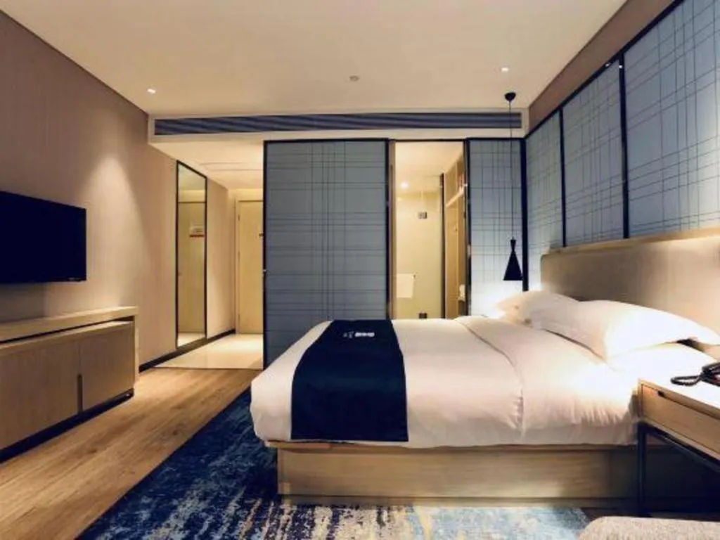 Bed in Echarm Hotel Wuhan Vanke Future Center Wulidun Metro Station