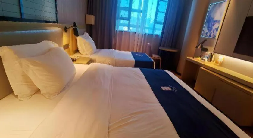 Bed in Echarm Hotel Wuhan Vanke Future Center Wulidun Metro Station