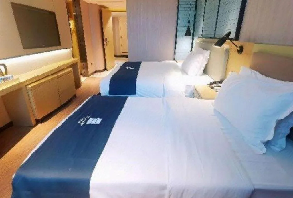 Bed in Echarm Hotel Wuhan Vanke Future Center Wulidun Metro Station