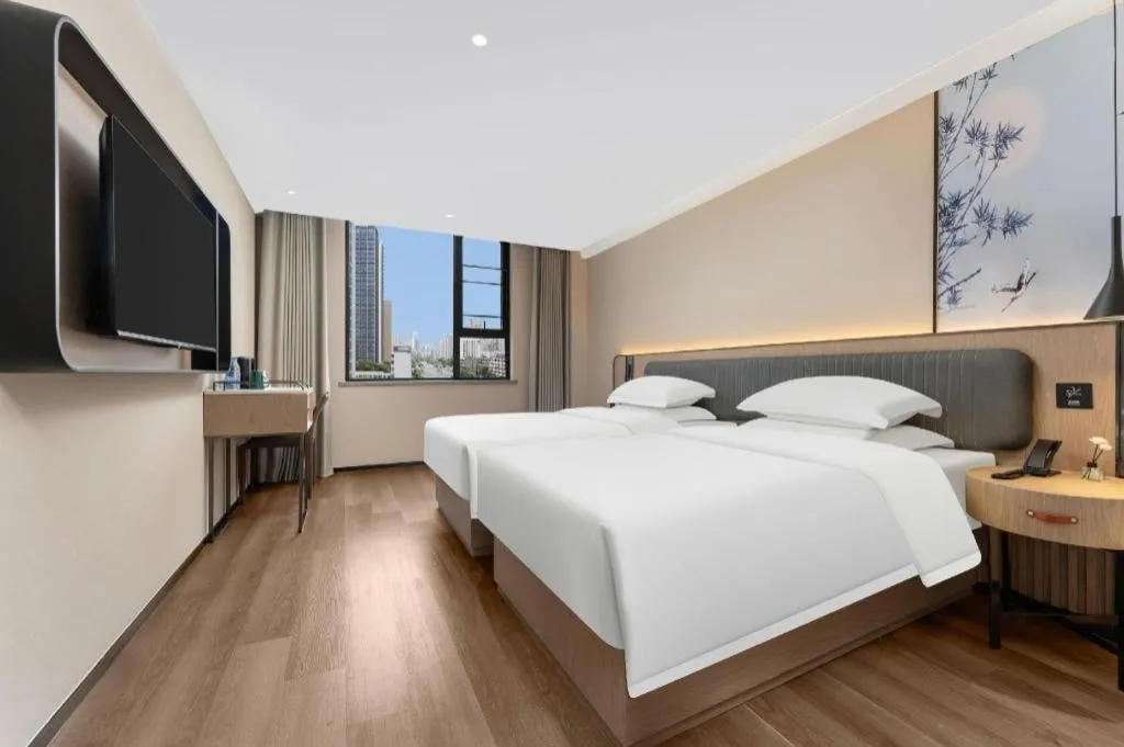 Bed in Echarm Hotel Wuhan Vanke Future Center Wulidun Metro Station